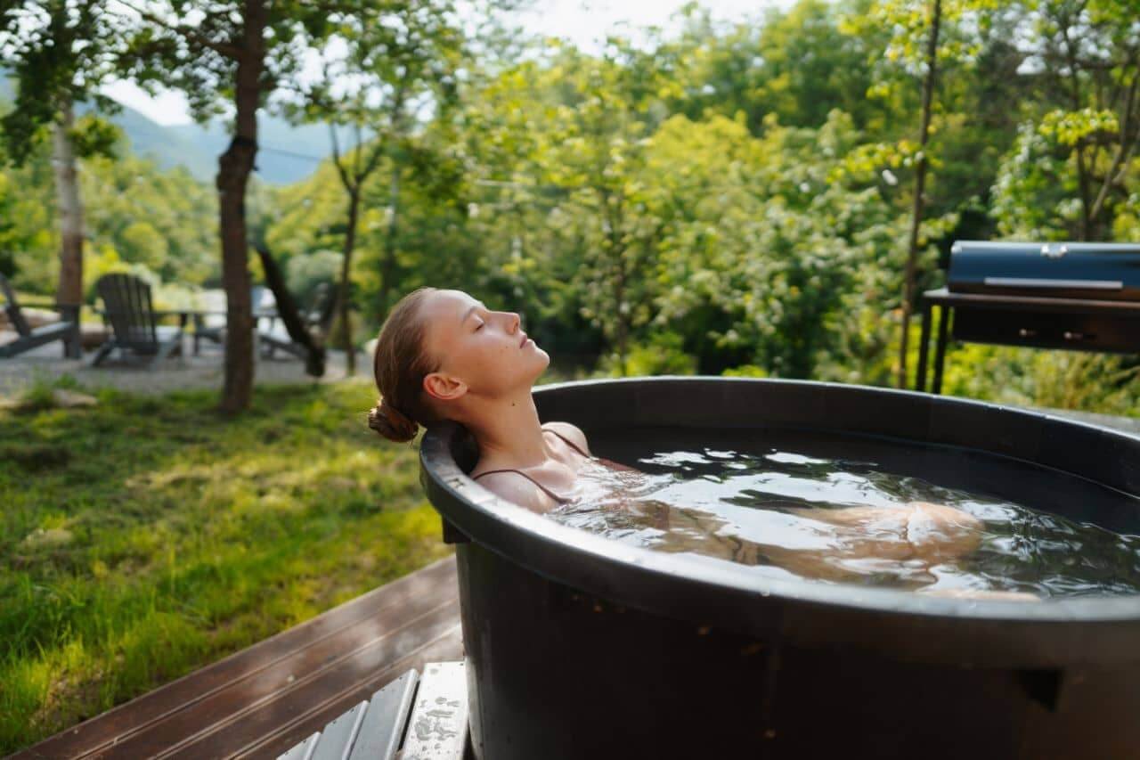 Woman experiencing cold water therapy benefits for wellness and mood